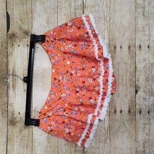 Super cute skirt swim bottoms in Orange and floral